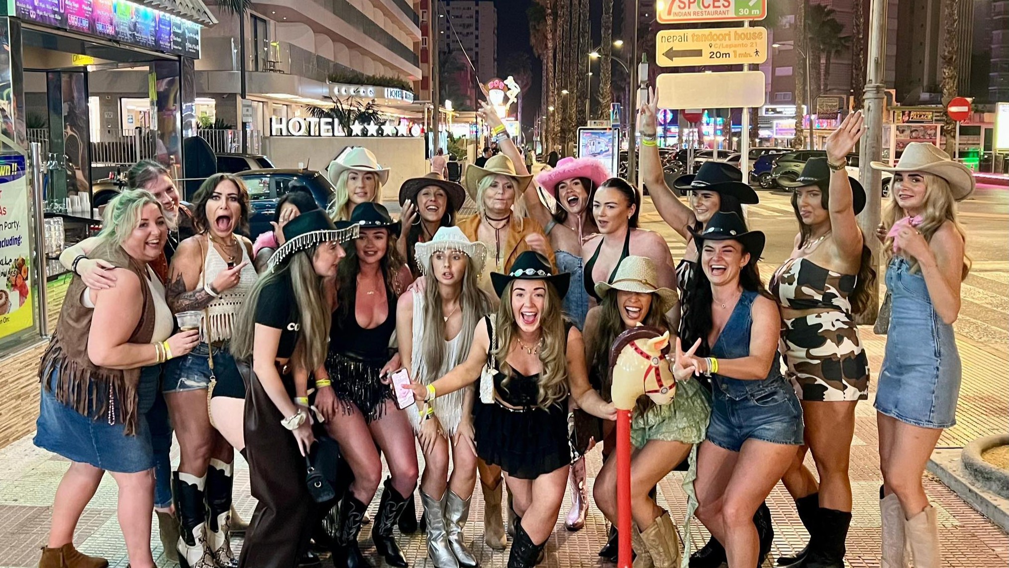 group fo laughing ladies wearing cowboy hats